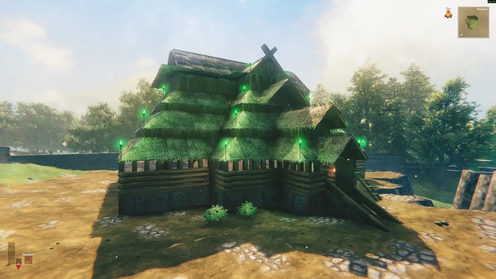 Stave-style timber hall with green torches and layered thatched rooflines.